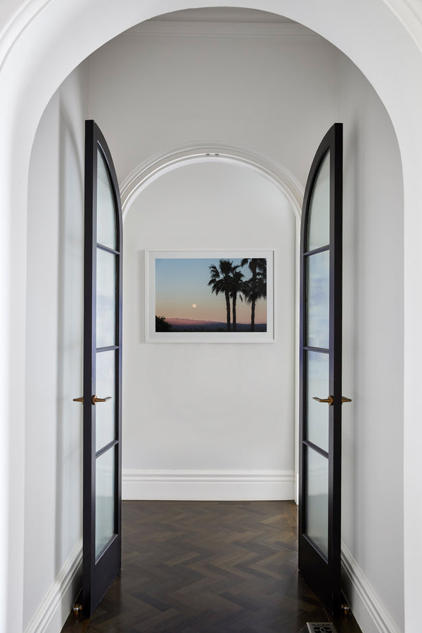 Limited-edition photography. Coachella Valley by Scott Ruzzene features palm trees against a sun set and desert