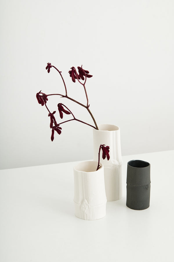 Limited-edition black and white porcelain vessels sculpted to reflect bamboo. Handmade in Melbourne