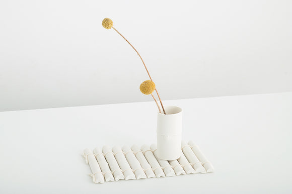 Porcelain vase formed from bamboo on porcelain bamboo mat. Handmade by Melbourne artist Sarah Hudson. Limited edition of 5